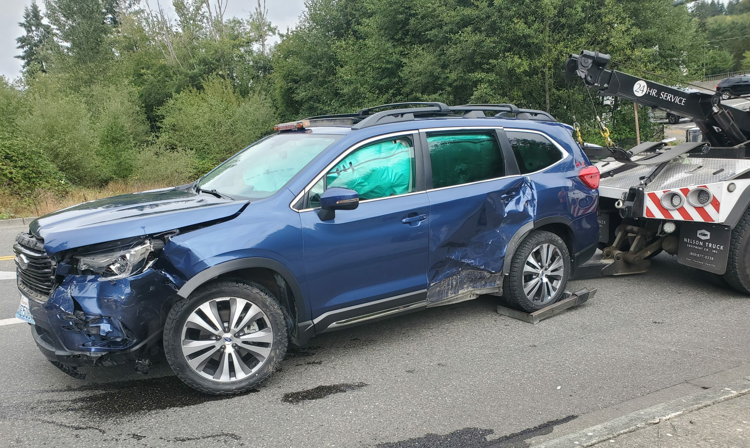 crashed-blue-subaru-scaled-e1663285391466.jpg